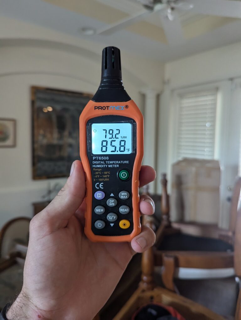 moisture meter detecting water damage inside residential home