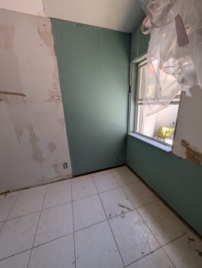 mold remediation demolition with drywall removal and containment during restoration project