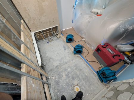 Containment setup with drying equipment during water damage restoration in Palm Beach County